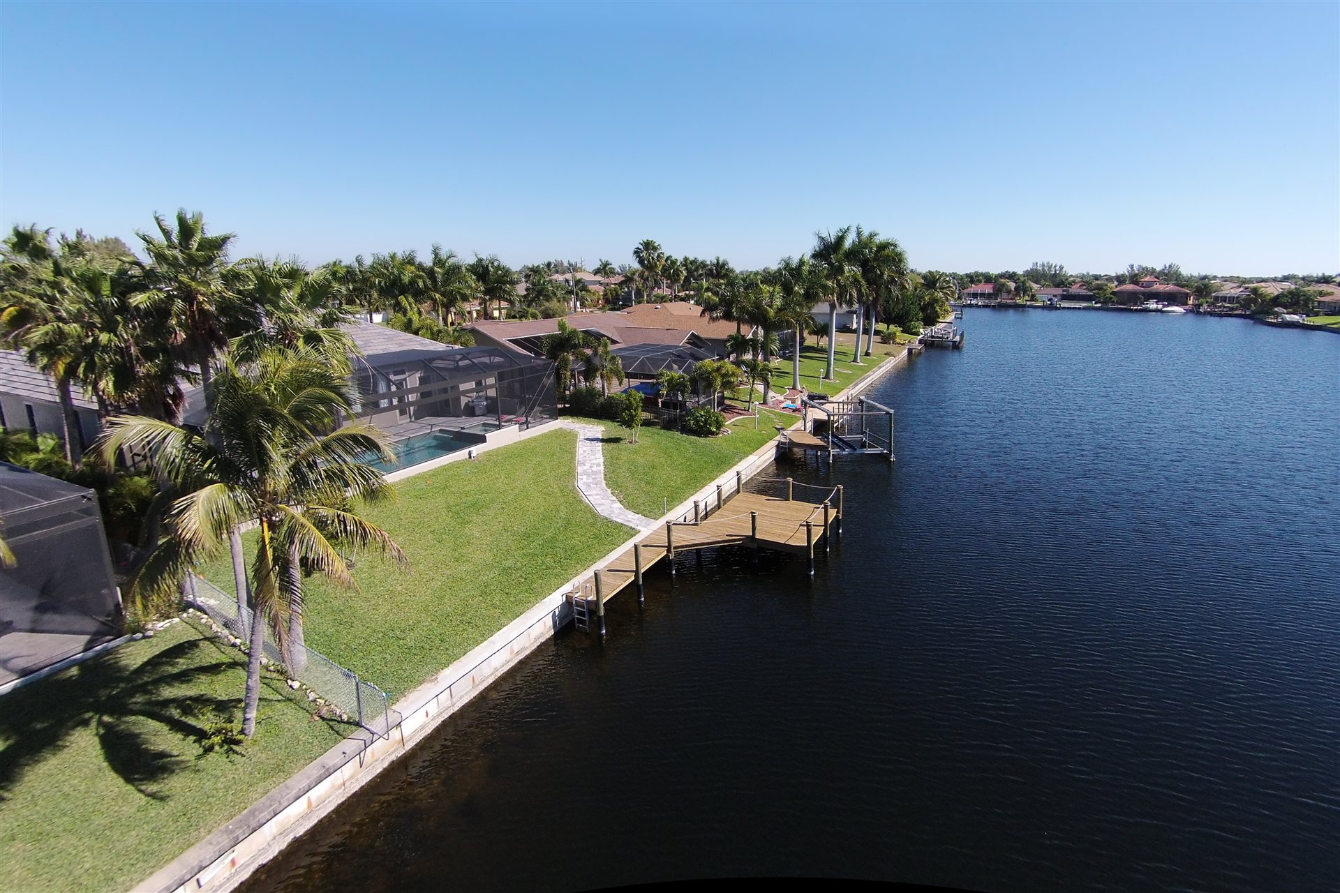 Aerial view of the canal with garden and boat dock