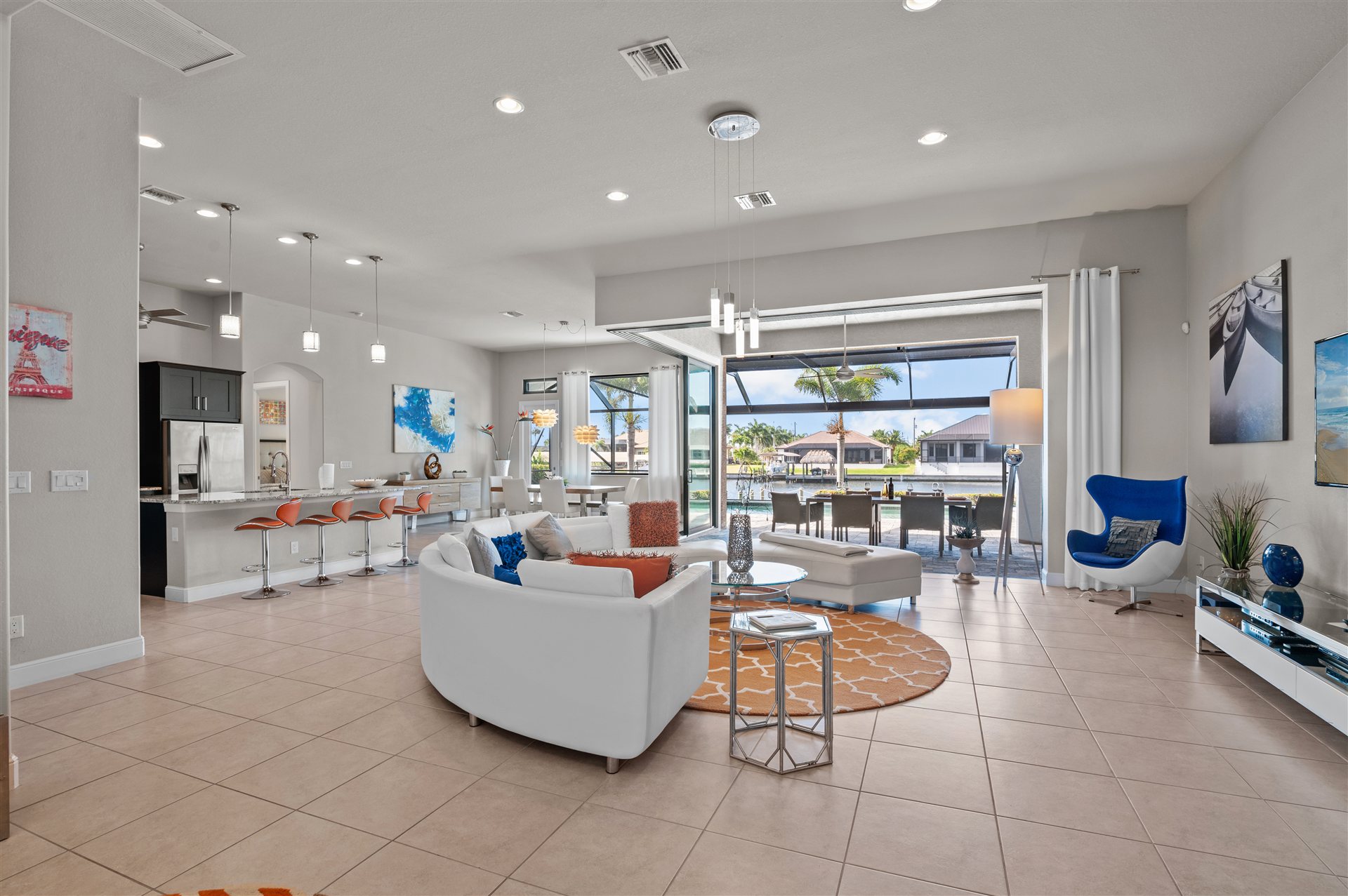 Open-plan living and dining area with kitchen and view outside